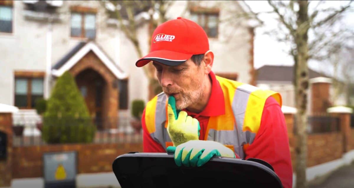 Oh, what's in here? Mental Health Awareness Month 4 bin man looking in a black domestic bin