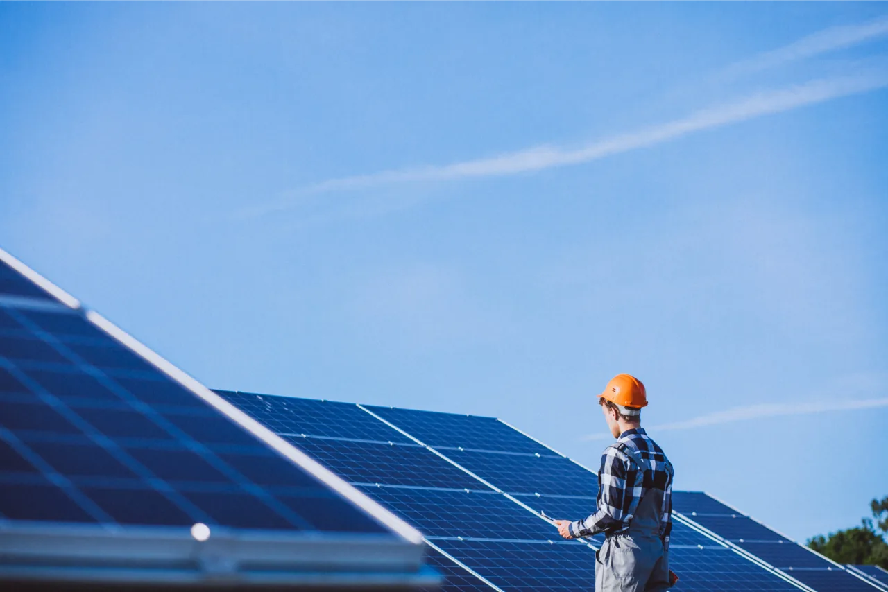 Commercial 44 man worker firld by solar panels scaled 1